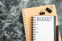 top view budget written note notepad with pen dark surface student color school money gray college copybook 179666 19729 uai